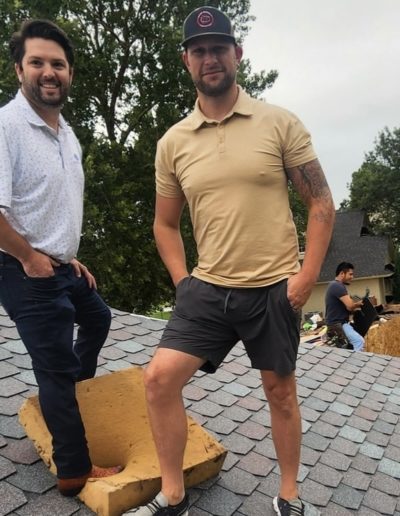 Cory Belter and a roof professional with Belter Roofing and Construction standing on an Oklahoma roof.