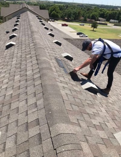 Belter Roofing and Construction doing a roof inspection in Oklahoma.