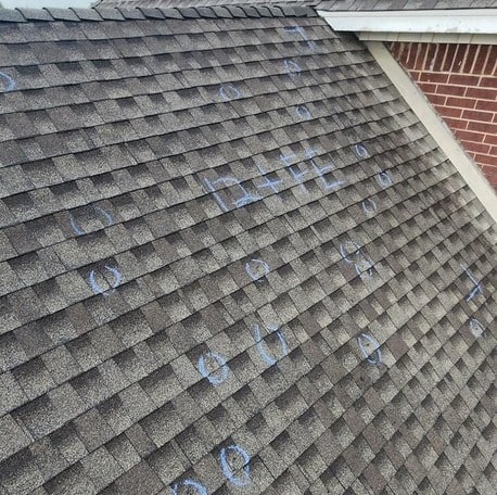 Visible hail damage on a residential roof in Oklahoma to file on an insurance claim.