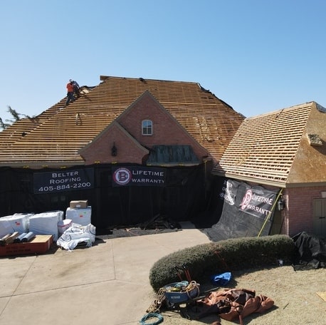 Belter Roofing OKC replacing a residential roof in Oklahoma.
