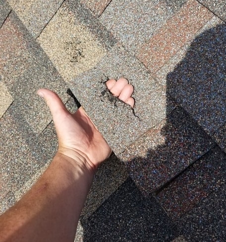 Cracked shingles are a good indicator that your Oklahoma home is in need of roof repair.