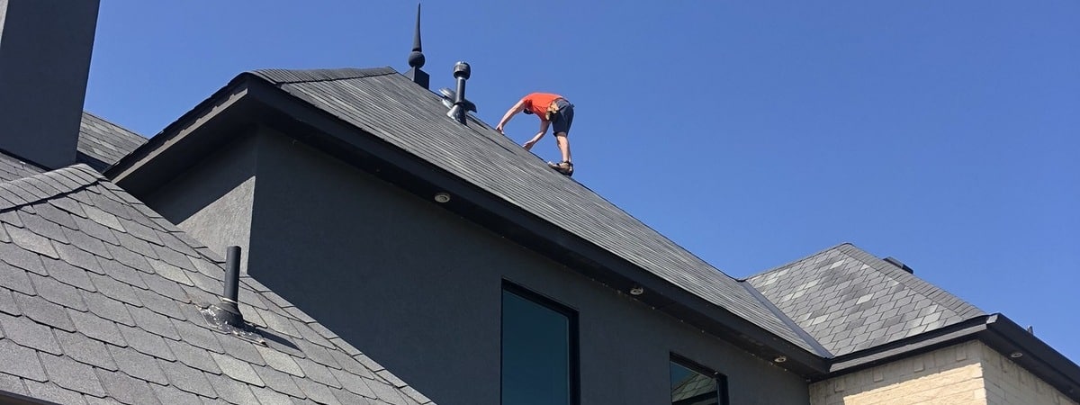 Performing an Oklahoma roof maintenance checklist on an residential home.