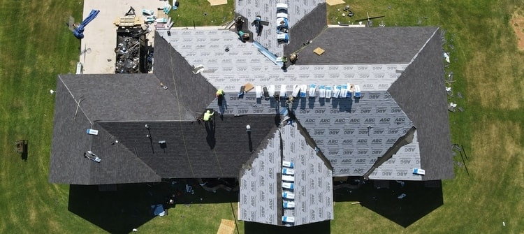 Oklahoma roof being repaired after a storm damage.